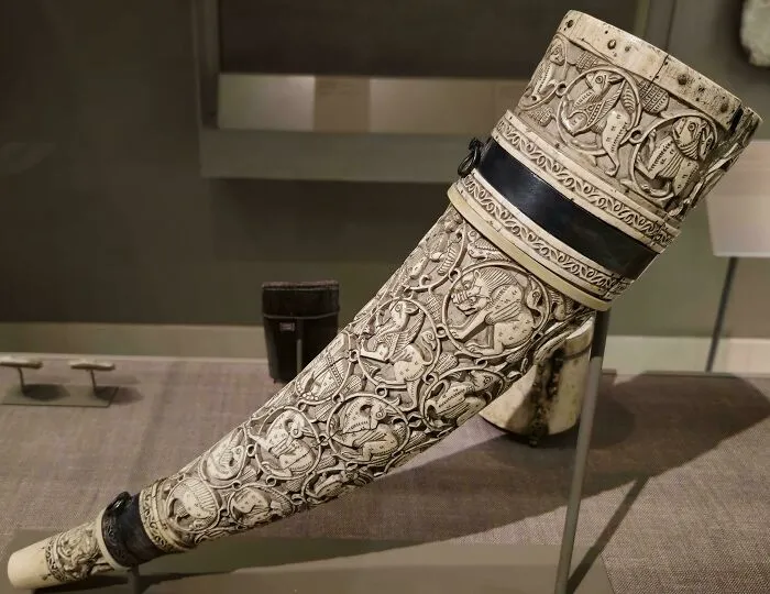 Carved ceremonial ivory horn with detailed animal motifs as an interesting artifact
