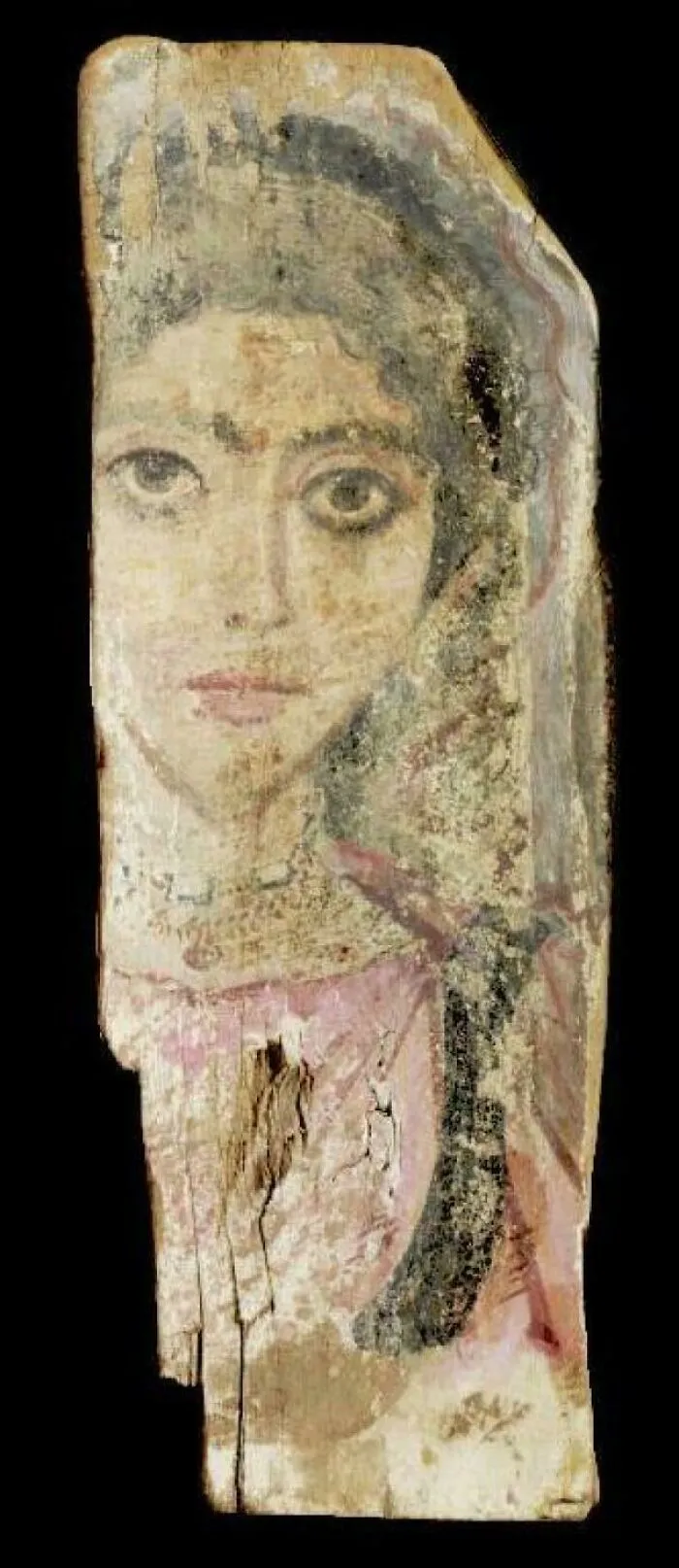 Ancient painted wooden panel featuring a woman's face, a creepy and strange artifact discovery