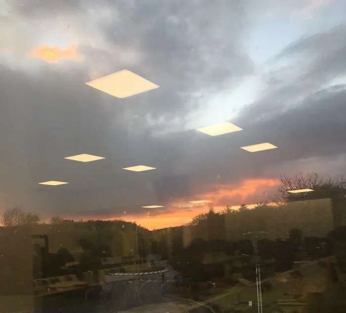 Strange photos of office lights reflecting in window like sky UFOs