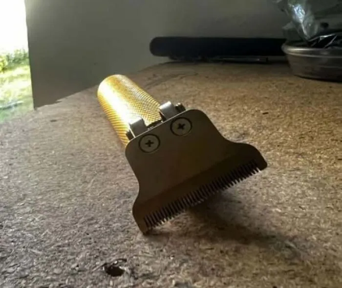 Hair clipper with blade resembling a face staring