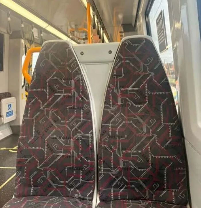 Bus seats patterned with designs that look like staring faces