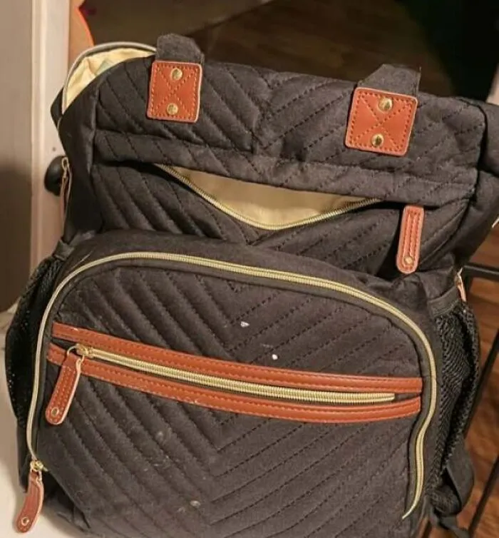 Backpack zipper resembling a smiling face