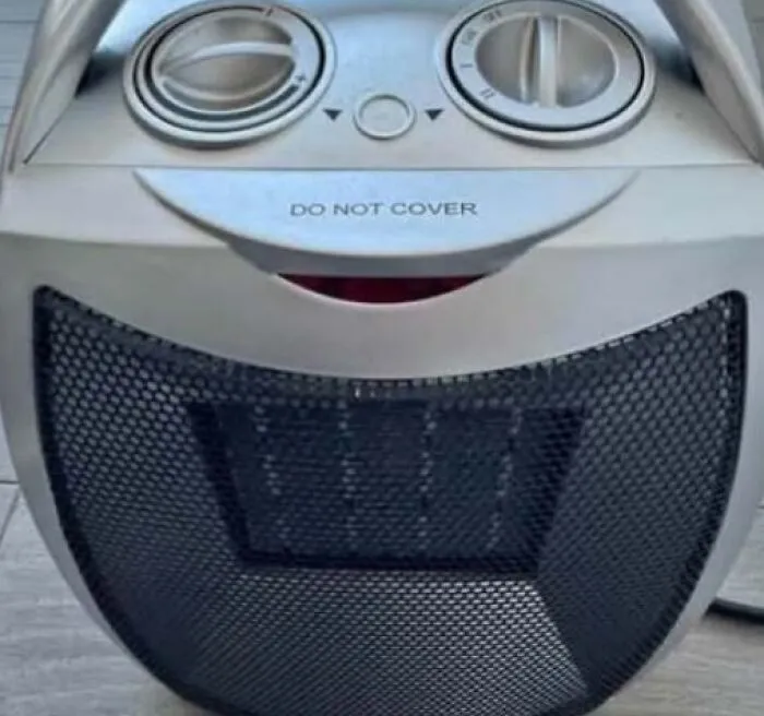 Heater controls and grill forming a random object staring illusion