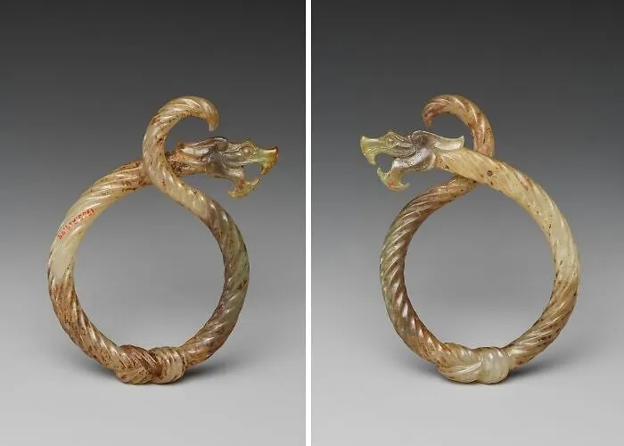 Jade bracelet shaped like a dragon with detailed carving