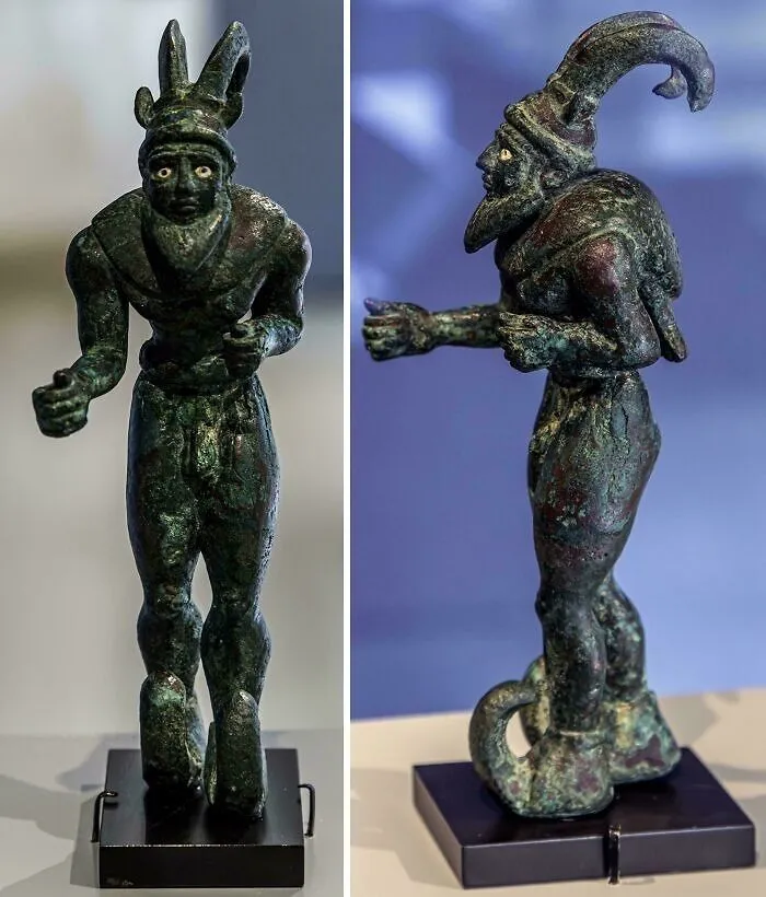 Bronze statuette of a figure with horned headgear ancient artifact