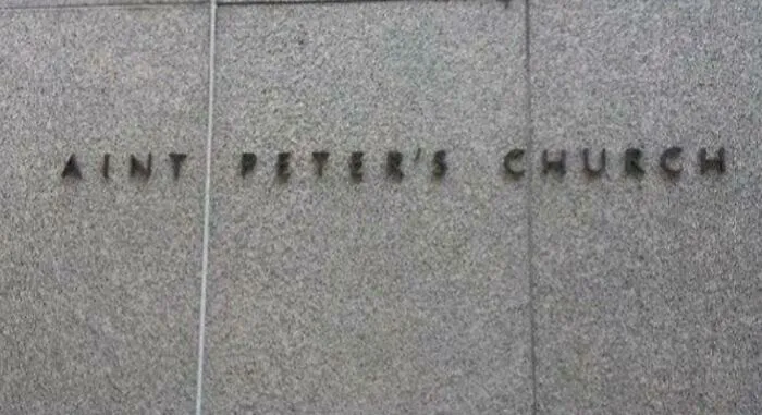 A granite church sign missing a letter to read Aint Peter s Church, showing clever vandalism