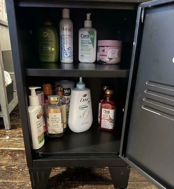 A shared bathroom cabinet filled with various skincare products, illustrating daily roommate stories.
