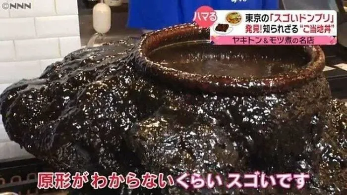 Large pot overflowing with thick dark sauce representing questionable food combos.