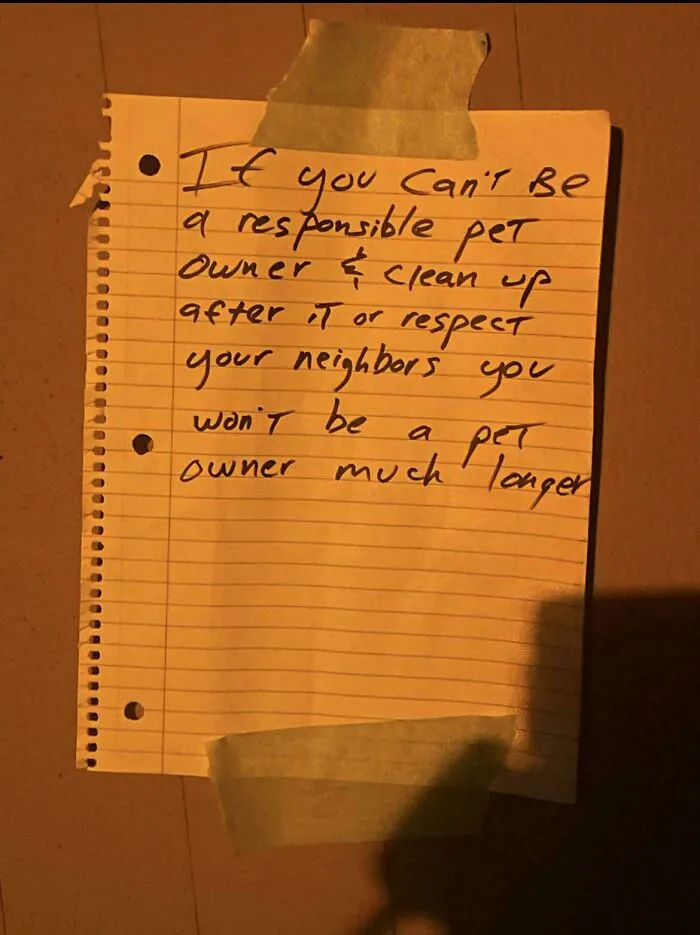A handwritten note warning a neighbor about irresponsible pet ownership.