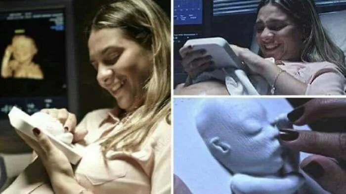 A blind mother smiling as she holds a 3D printer ultrasound model of her unborn baby