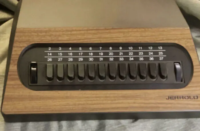 Vintage Jerrold switch TV channel dial with wood finish nostalgia