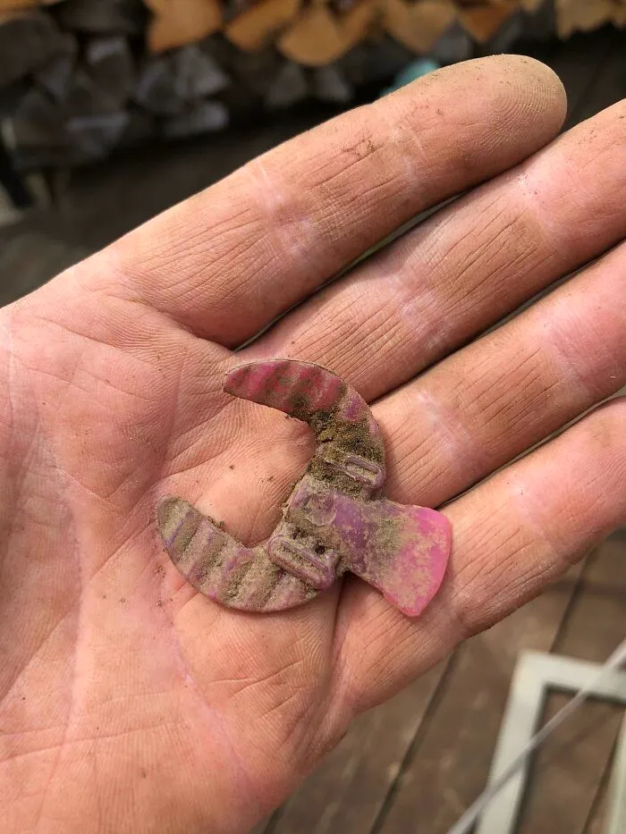 Old plastic toy piece found in hand evoking nostalgia