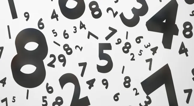 Scattered black numbers floating on a white background representing a basic math general knowledge quiz.