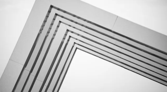 Modern architectural frame creating a geometric right angle against a light sky