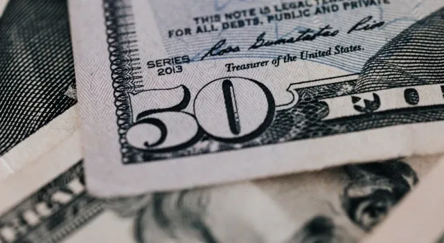 Close-up of a 50 dollar US bill, representing the US president on money.