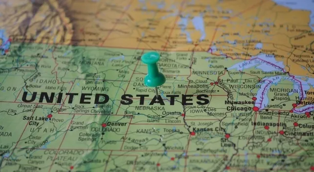 A map of the United States with a green pushpin, indicating the largest state in the US.
