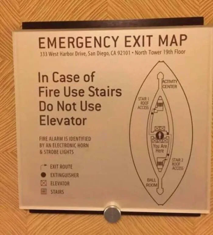 Confusing emergency exit map with unclear fire escape directions in a building