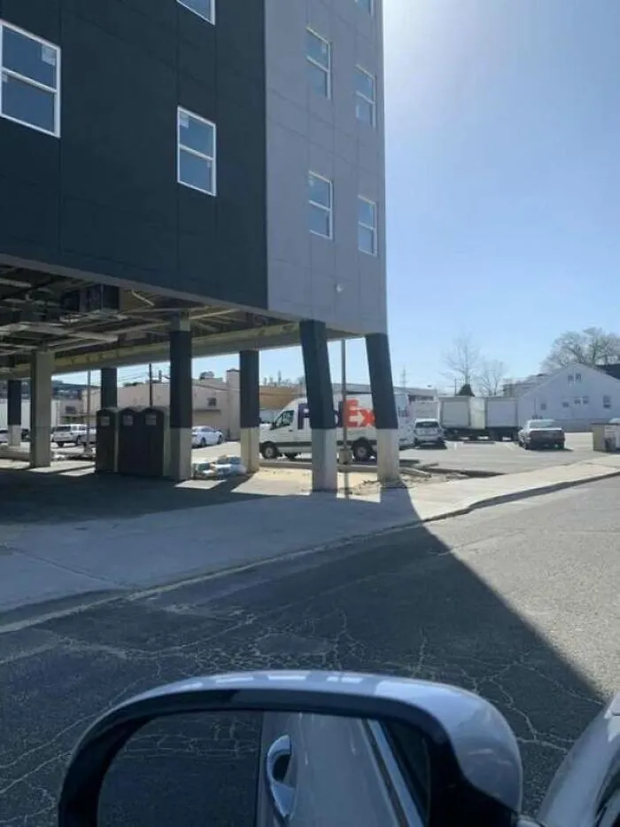 Building supported by tilted and unstable-looking supports posing a construction fail