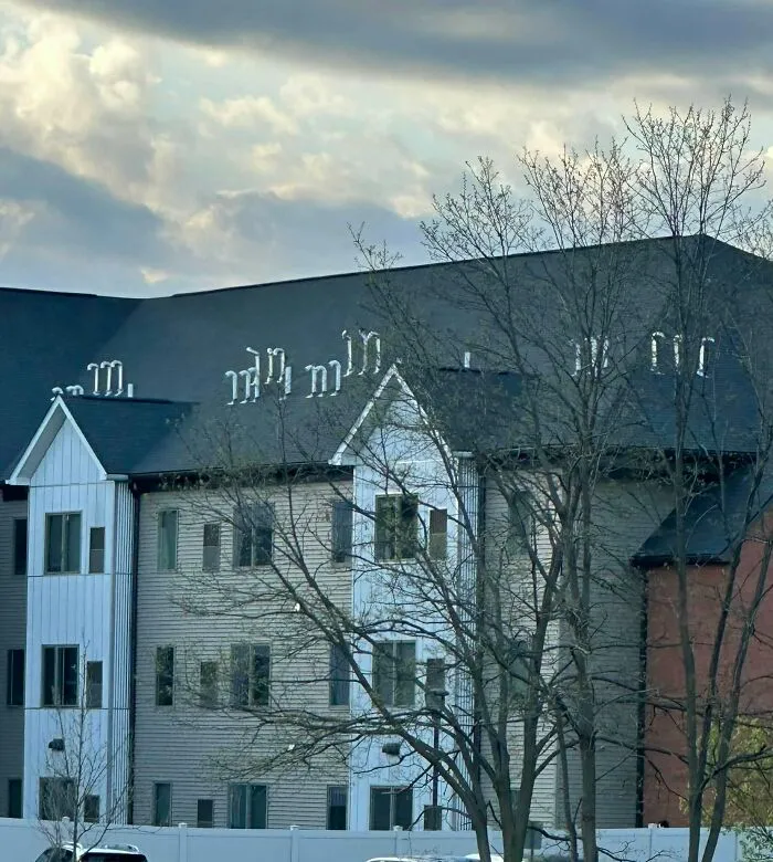 Construction fail with multiple bent roof vents on residential building
