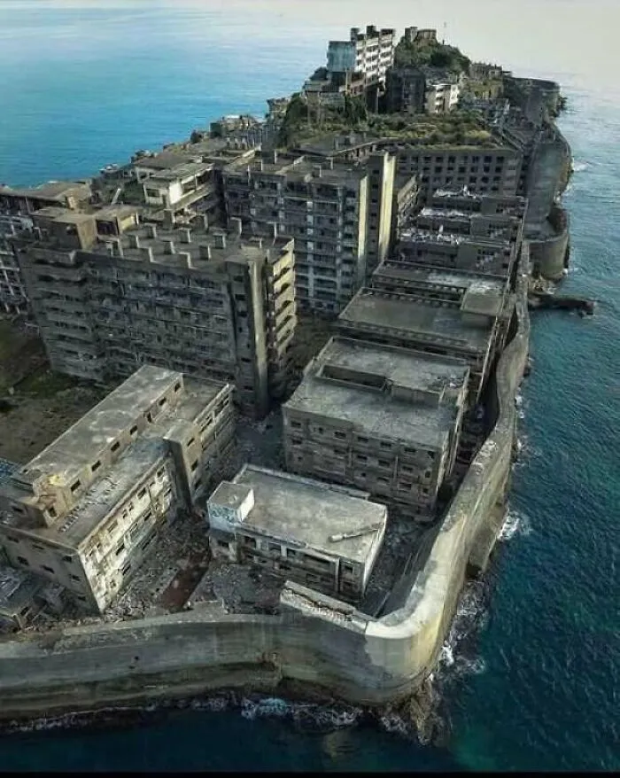 Abandoned concrete buildings on island showing extreme construction fail