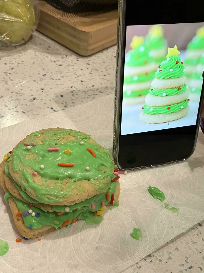 Green frosted christmas tree cookie stacked messy beside a reference photo baking fail