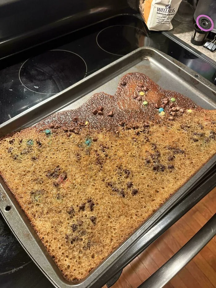 Flat, over-expanded cookie sheet bake presenting a hilarious baking fail.