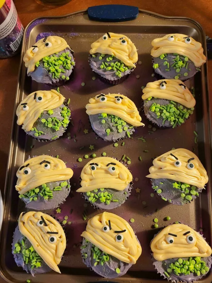 Tray of funny decorated cupcakes showing a baking fail attempt at monster faces.
