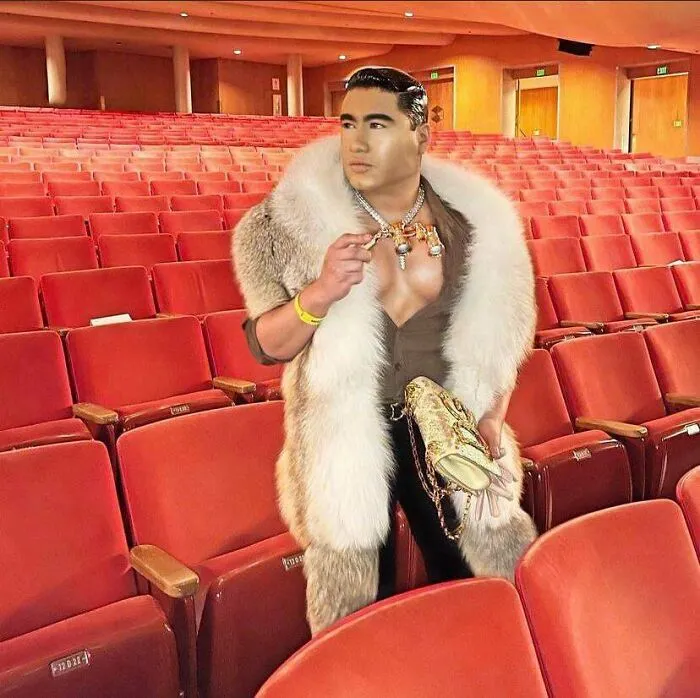Ridiculous edited photo of man in fur coat in empty theater