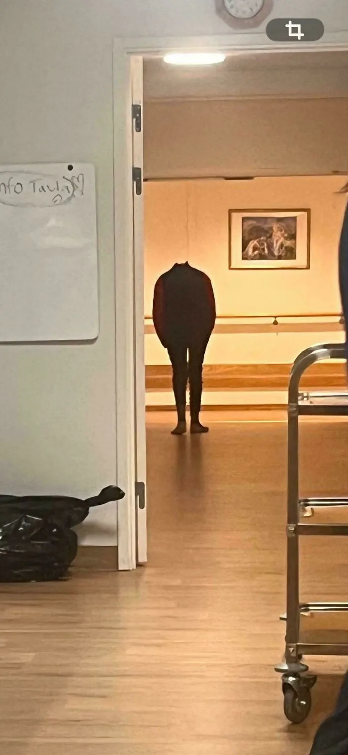 Headless shadow figure standing in a doorway as seen in creepy photos