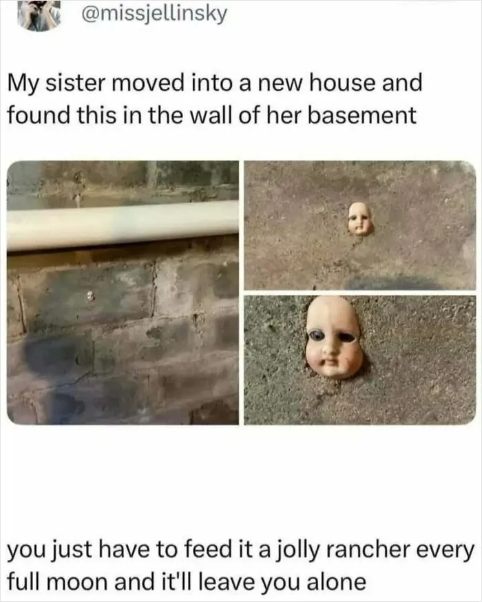 A creepily embedded doll head in a basement wall featured in cursed images.
