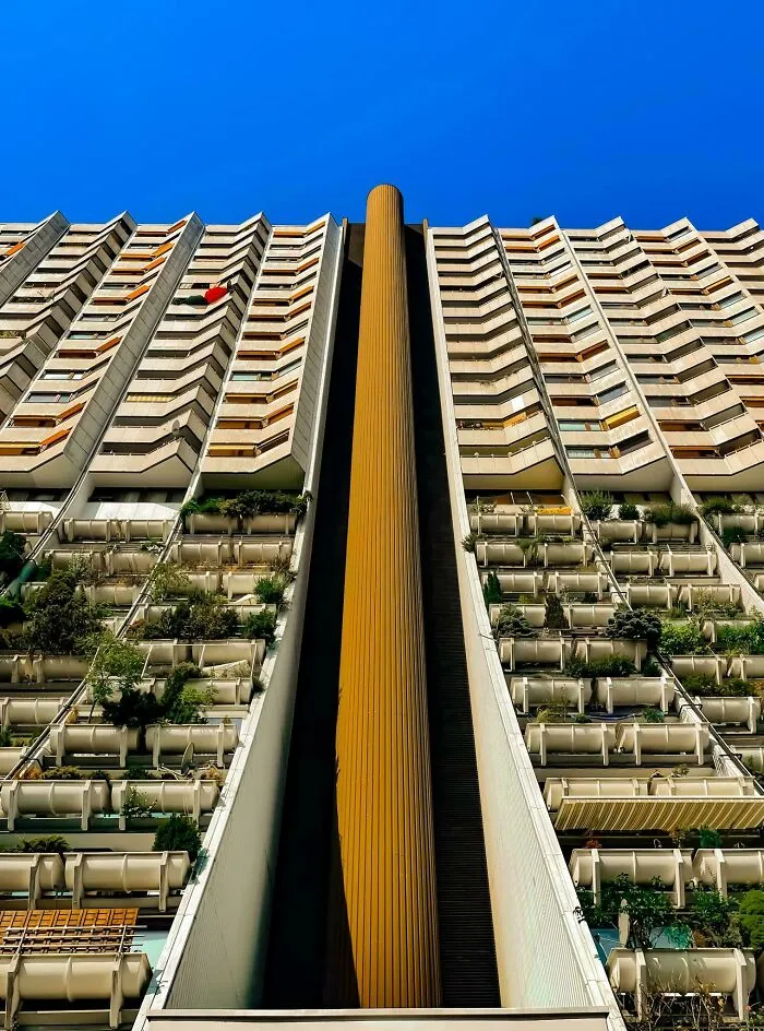 Low-angle view of a unique residential building showcasing innovative architectural design
