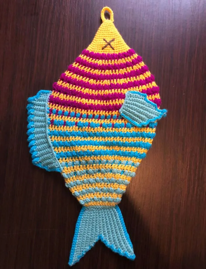 Striped crochet fish with fins and tail in bright colors