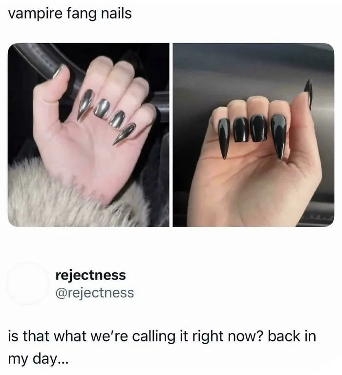 Vampire fang nails trend with black and metallic nail designs
