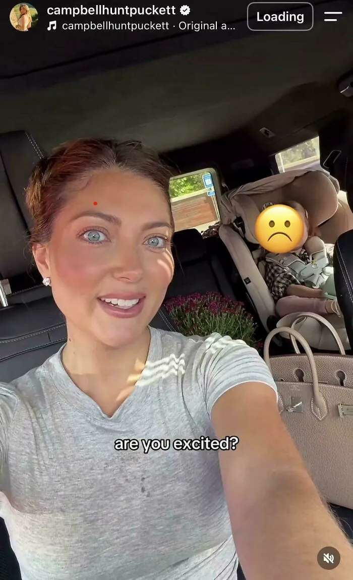 Influencer selfie in car with child emoji face and caption are you excited