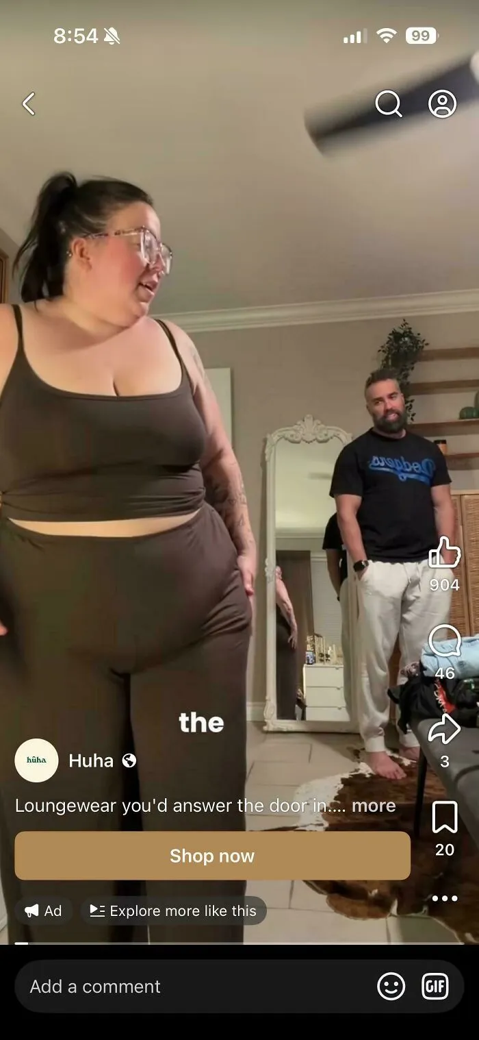 Woman in loungewear with man in room promoting loungewear to answer the door