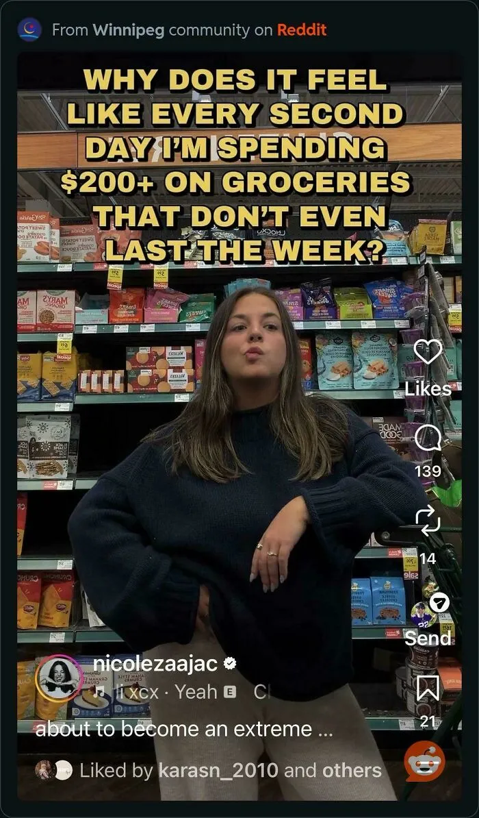 Woman shopping in grocery aisle frustrated by high grocery costs