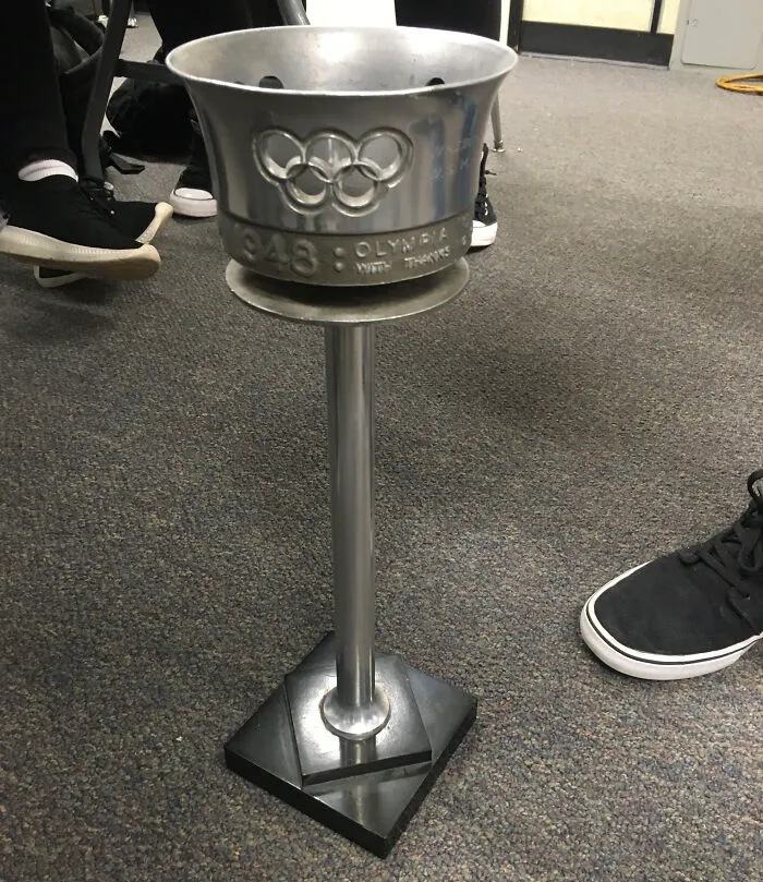 1948 Olympic torch holder with Olympic rings emblem on a stand
