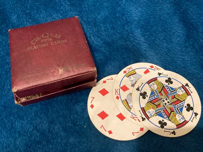 Vintage Cir-Q-Lap playing cards with box on blue fabric