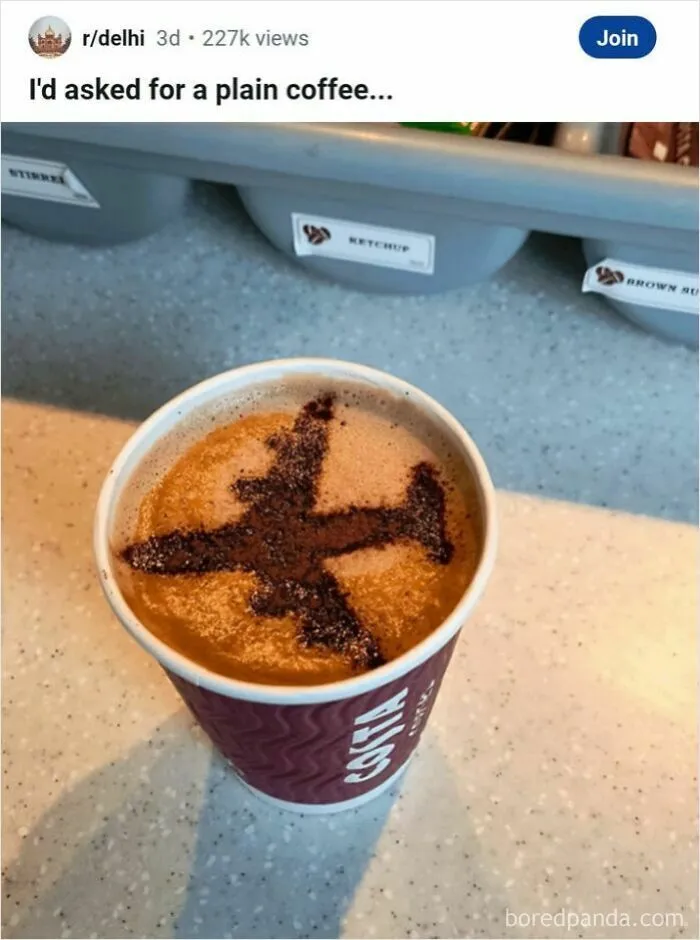 Coffee cup with airplane shaped cocoa powder art titled plain coffee meme