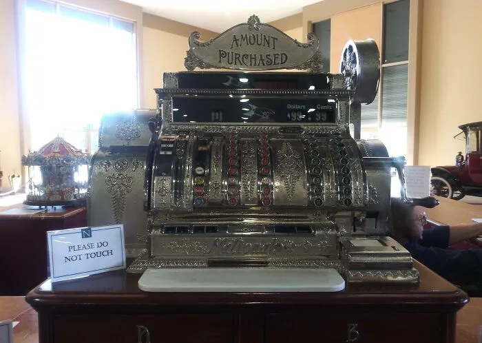 Rare historical photo of an antique ornate cash register showing amount purchased