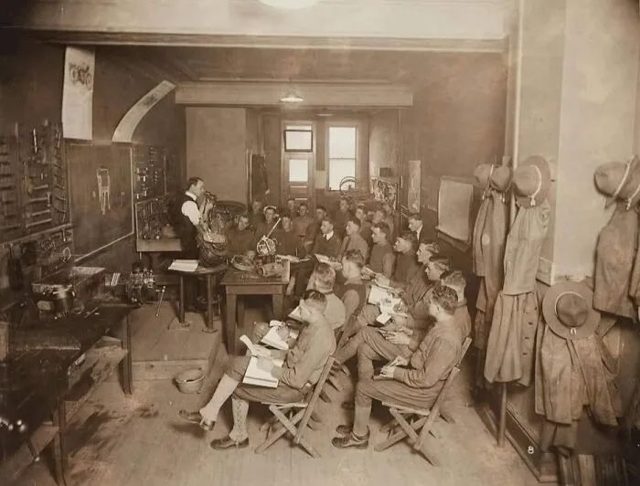 Rare historical photo of classroom with soldier students and instructor