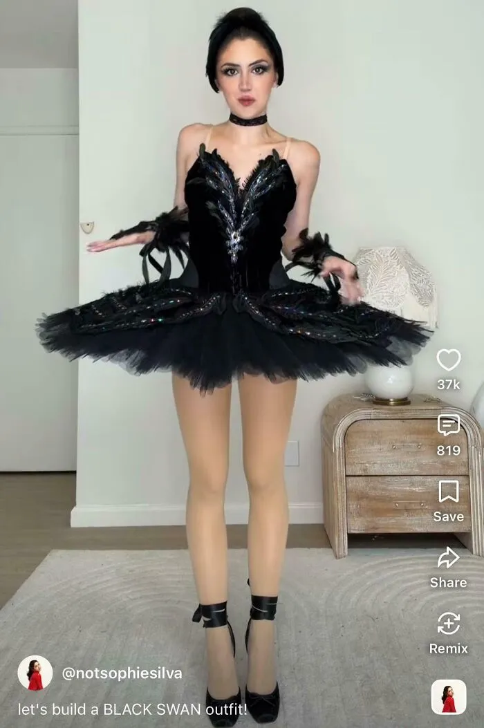 Person dressed in detailed black swan outfit for creative influencer post