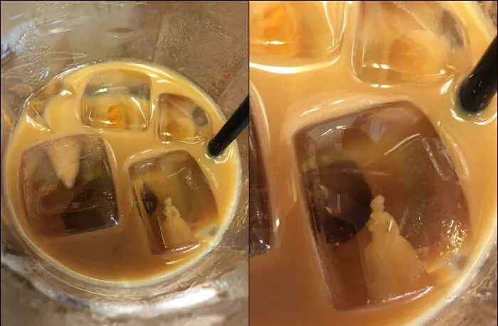 Iced coffee with ice cube resembling a figurine glitch in the matrix