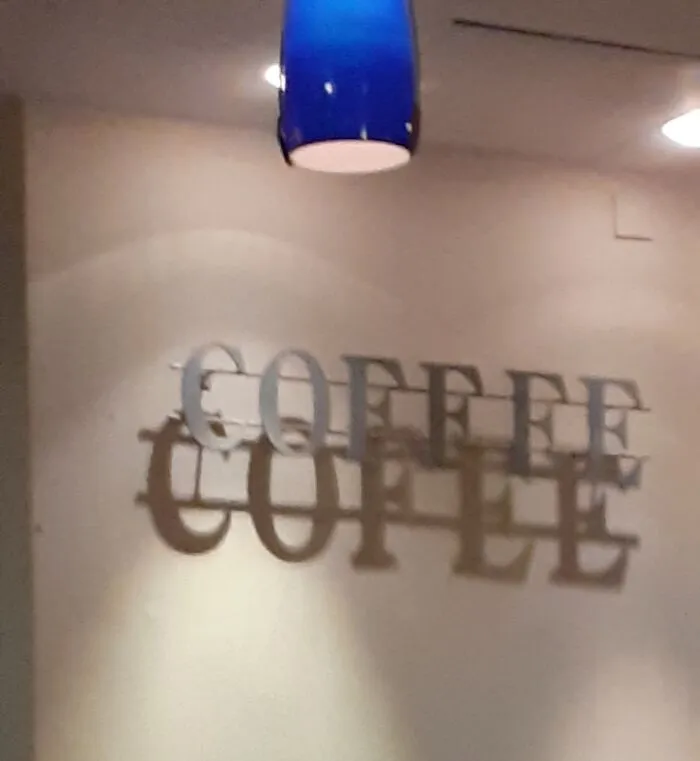 Wall decor casting overlapping shadow glitch spelling coffee twice
