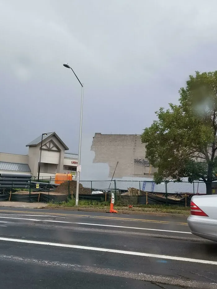 Grey wall missing part of its construction in a construction site