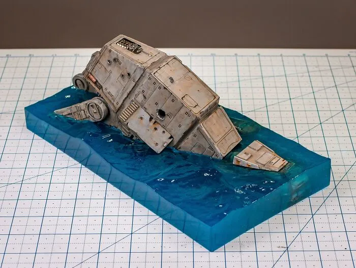 Miniature model of an armored vehicle partially submerged in resin water