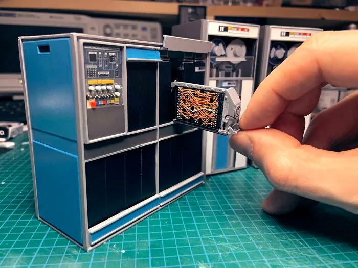 Miniature vintage computer model with removable detailed part showing craftsmanship