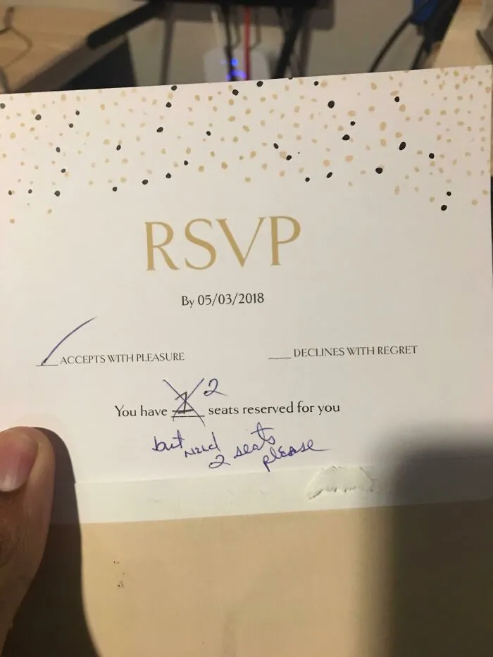 Wedding RSVP card requesting two seats reserved for guest