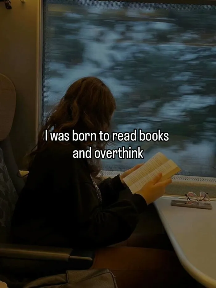 Person reading book on train with reading and overthinking text