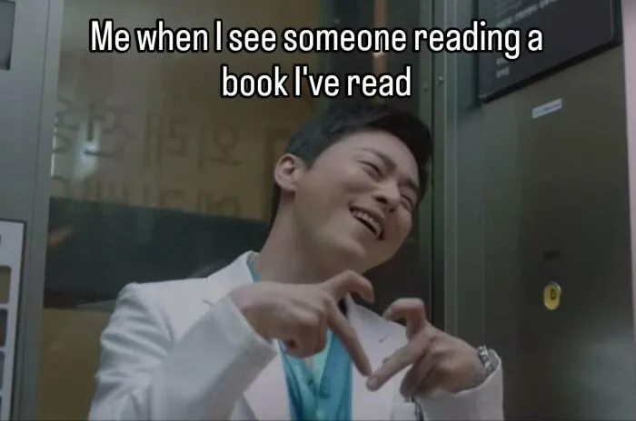Man making heart symbol happy seeing someone reading a book he's read reading meme